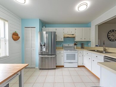 Kitchen with under cabinet range hood, stainless s