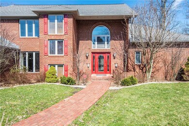 Pretty brick walkway leads to your front door.