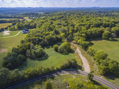 Mature trees surround the property, providing plenty of shade and privacy for your future home!