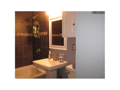 This 2010 sleek and contemporary main full bathroo