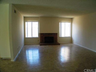 Living room with brick fireplace