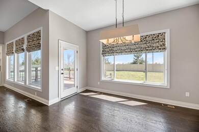 Wall of windows with door to large back covered deck