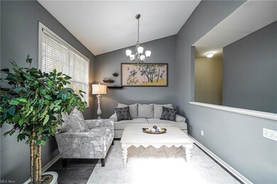 Living room space with vaulted ceilings and large 
