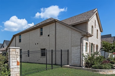 View of home's exterior featuring a gate and stone siding