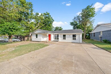 Ranch-style house with a front lawn