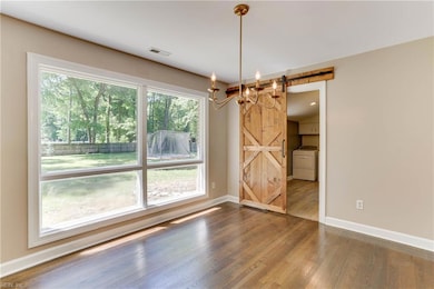 Barn-style door leading into the over-sized laundry room.