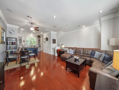 Living room looking into the dining & kitchen area