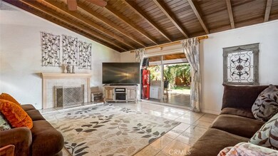 Spacious Living Room with gas Fireplace, High ceilings and sliding door to back yard covered patio for easy indoor-outdoor entertainment