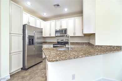 Kitchen featuring cabinet pantry & breakfast bar.