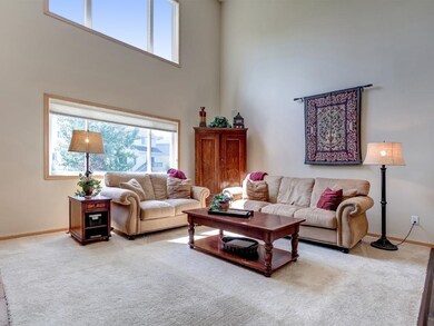 Great room has high vaulted ceilings and remote co