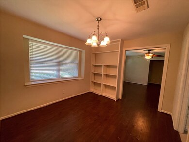Side view of the formal dining with built in shelves
