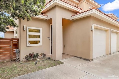 View of front of property featuring stucco siding and a tiled roof