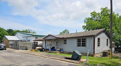 View of front of house with cooling unit