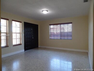 Reverse view of living area from dining/hallway.