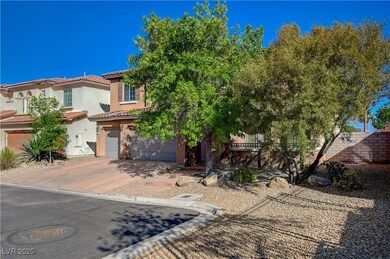 View of front of property with a garage, a tile ro