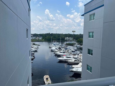 Water view featuring a marina