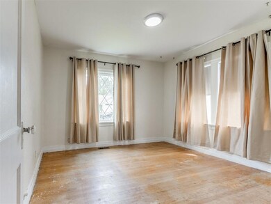 Empty room featuring light hardwood / wood-style f