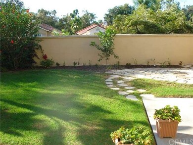 Large private yard with new planting.