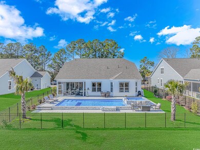Back of house with a patio, a lawn, a fenced in po