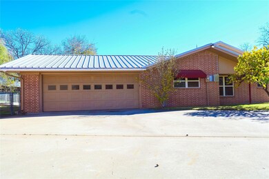 View of front facade featuring a garage