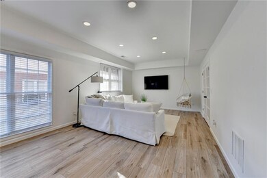 Living area featuring light wood-style flooring, v