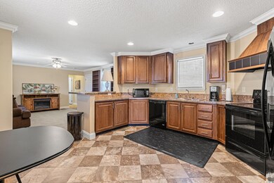 Kitchen with kitchen peninsula, a textured ceiling