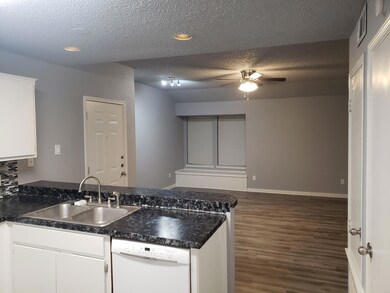 Kitchen with dishwasher, a textured ceiling, ceil