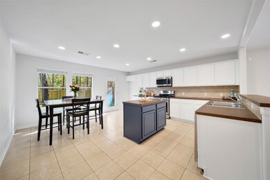 Entrance to huge island kitchen with tons of cabinets and counter space !