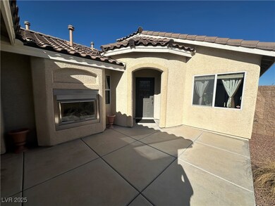 Doorway to property with a patio area