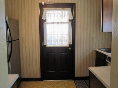 Kitchen. Side door leading outside from the Kitche