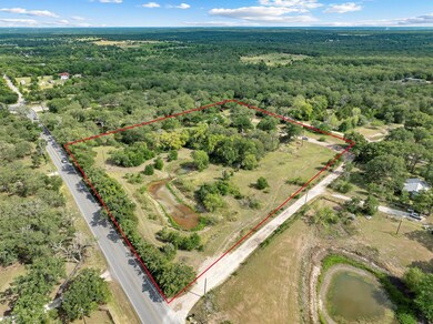 View of property location with a forest and prope