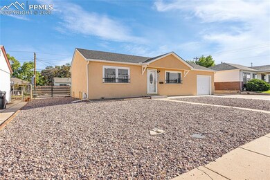 Bungalow with a garage, stucco siding, and a gate