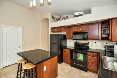 UPGRADED KITCHEN WITH ISLAND SLAB GRANIT