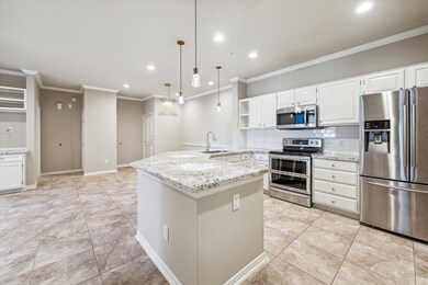 The kitchen features top-of-the-line Samsung appli