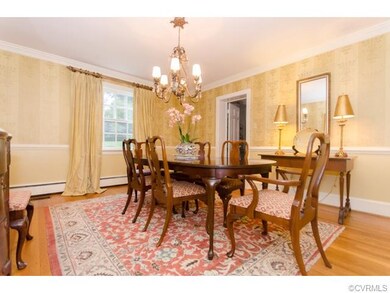 Sunny Dining Room w/crown molding, chair rail