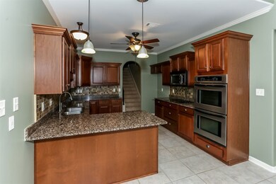 Second view of this lovely kitchen from the breakfast area.