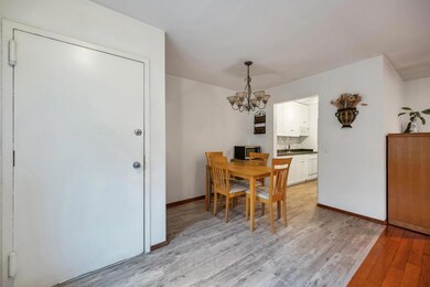 Dining area featuring a chandelier, light wood-sty