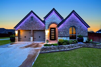 Absolutely breathtaking any time of day or night, this magnificent single family, single story brick/stone/stucco Perry treasure is located at 14318 Splendid Oak Drive, Cypress, TX, in the lush Copper Ridge community. Gorgeous artisan-like construction and detailing are just some of the unequalled qualities that give this special residence outstanding curb appeal. Attached garages are seen, left, atop an inviting double-wide driveway, a great feature for guest vehicles.