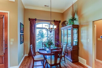 Dining Room features gleaming nail down hardwood floors and upgraded lighting!