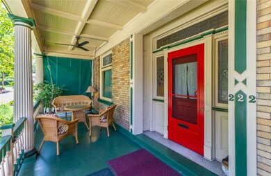 Gorgeous front porch expands the width of the hous