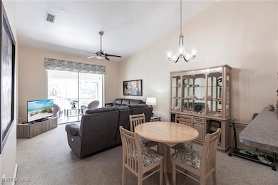Dining space featuring carpet floors, ceiling fan