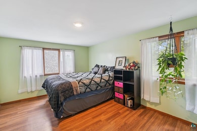 Bedroom with wood finished floors