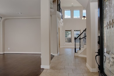 Formal dining and living room to the left of the e