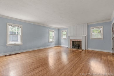 A cozy fireplace in this large Living Room