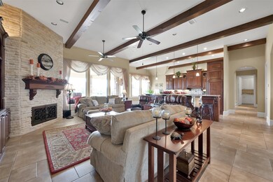 The gas fireplace has wrought iron doors and a che