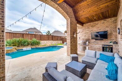 The heated pool and outdoor kitchen offers year-ro