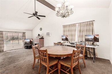 Carpeted dining space with a wall mounted AC, high