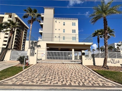View of front facade with a gate, a fenced front yard, and stucco siding