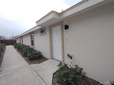 Property entrance with stucco siding