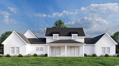 The rear of the home with large covered porch. Thi